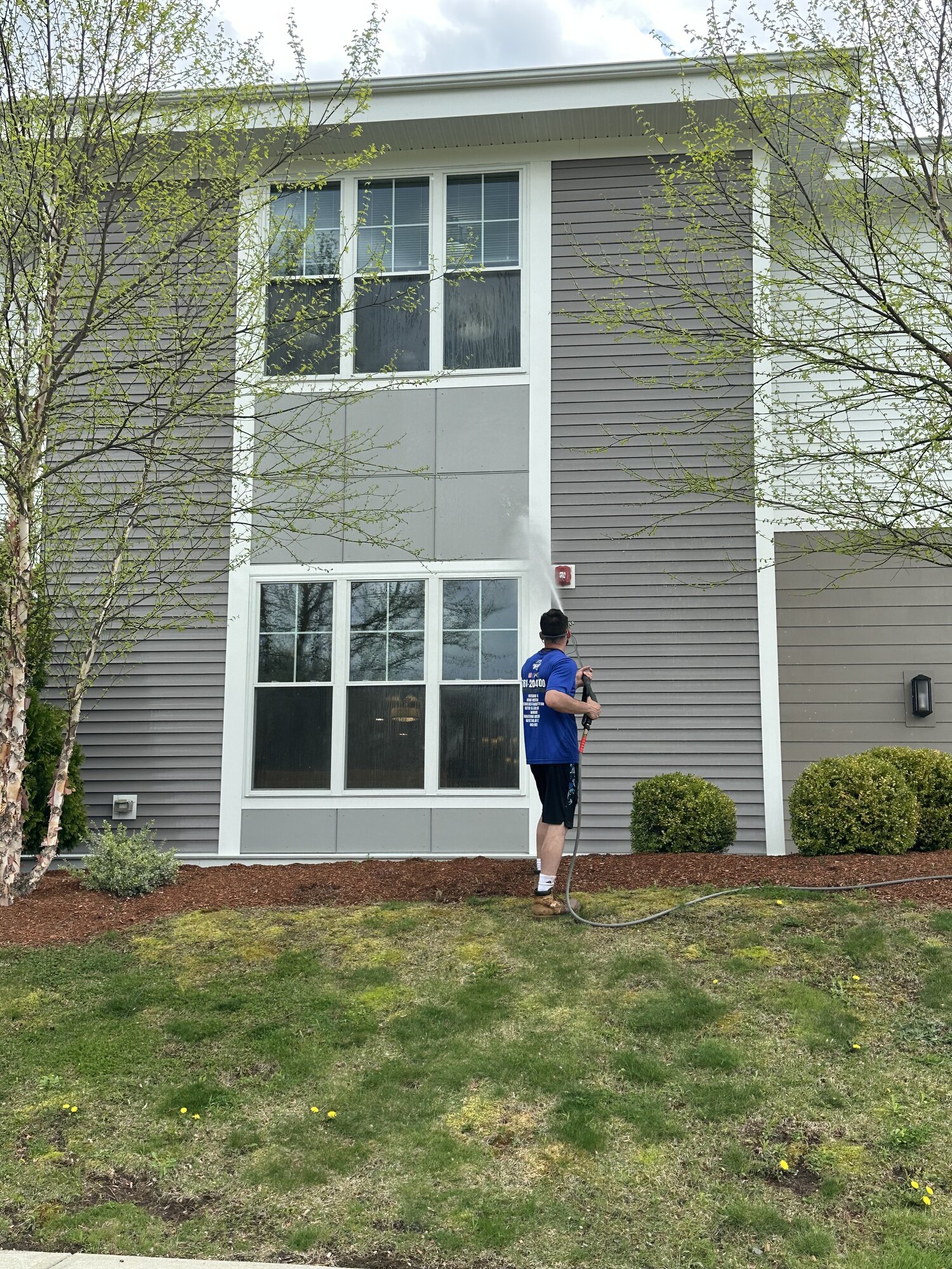 Diamond Corp crew soft washing a luxury home